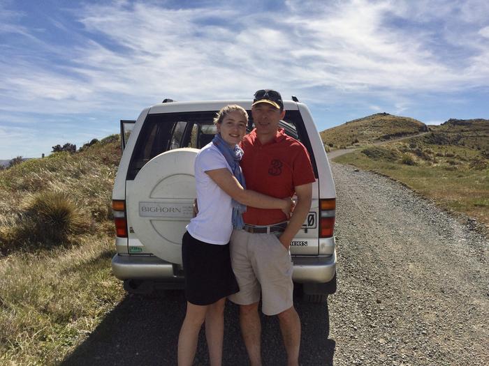 Emily Muggeridge and her companion together beside a vehicle on a country road